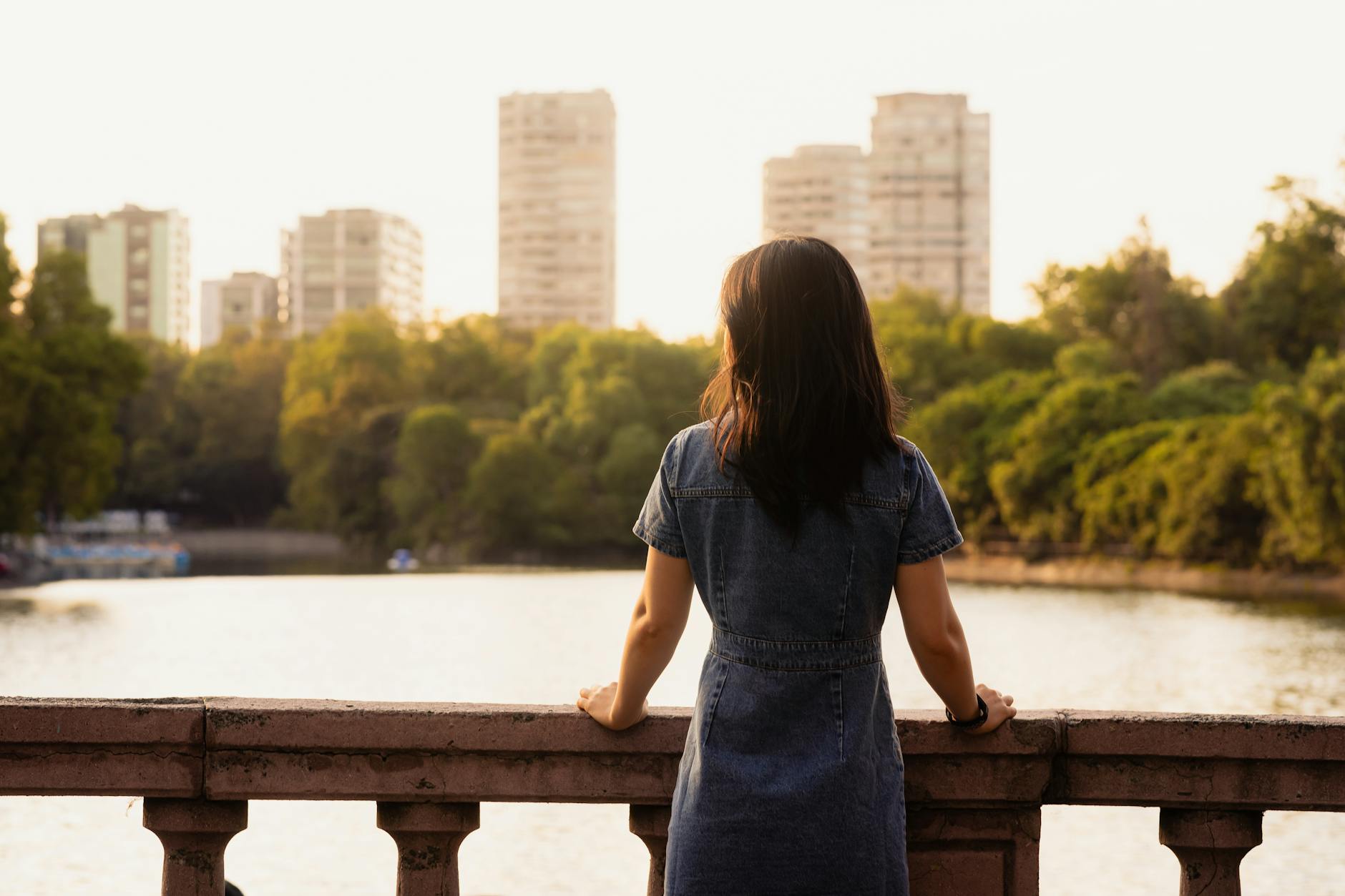 woman by the lake in a tropical park